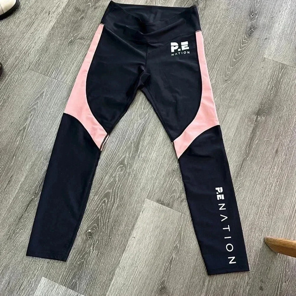 P.E. NATION  The Chasse Legging Black/Salmon
Regular price$140 Size Large - Picture 3 of 6